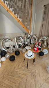a room with a bunch of silver balloons and a table at Marivar living in Nea Fokea
