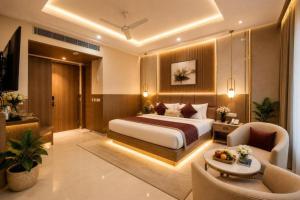 a hotel room with a bed and a couch at The Runway Corporate Hotel IGI Delhi Airport Terminal-3 With Free Airport Pickup in New Delhi
