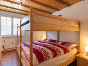a bedroom with a bunk bed in a room at Apartment Wohnung Wettstein by Interhome in Sörenberg