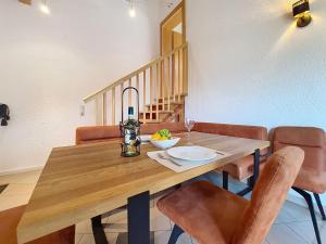 a dining room with a wooden table and chairs at Apartment Vöstl by Interhome in Navis