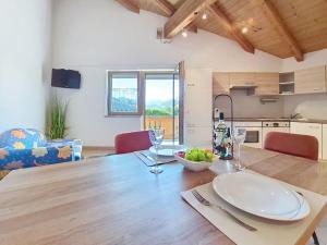 a kitchen and dining room with a wooden table at Apartment Vöstl by Interhome in Navis +19 photos