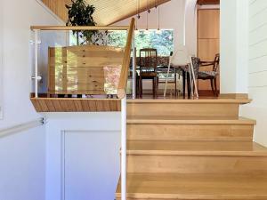 a staircase in a house with a dining room at Chalet Chalet Chaudoudoux - Les Paccots by Interhome in Les Paccots