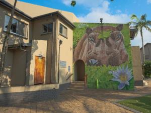 a mural of a bear on the side of a building at Lakeview Cabanas - Unit 11 in St Lucia