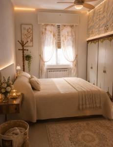 a bedroom with a large bed and a window at Da Leo & Mia in Modena