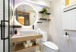 a bathroom with a sink and a mirror at Ski Lodge Sierra Nevada in Sierra Nevada