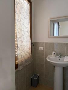 a bathroom with a sink and a mirror at Il Rifugio della Grotta S.Ninfa in Santa Ninfa