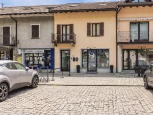 a street with cars parked in front of buildings at Apartment Legnone by Interhome in Sorico