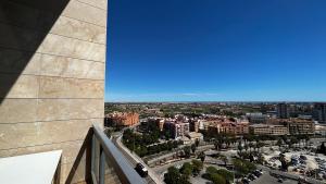 a view of a city from the top of a building at Loft en Valencia in Burjassot