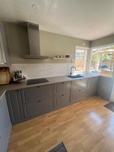 a kitchen with a sink and a counter top at Skiftehuset in Ytterby