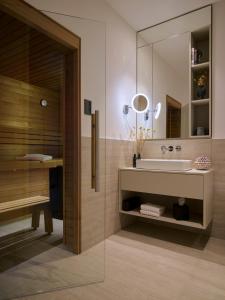 a bathroom with a sink and a mirror at THE BALTIC VIEW Sellin in Ostseebad Sellin +63 photos
