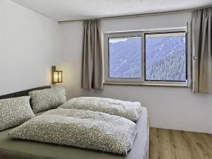 a living room with a couch and a window at Apartment Eben by Interhome in Hippach