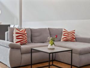 a living room with a couch and a table at Apartment Laura - S7 by Interhome in Endingen +14 photos