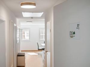 an empty hallway of an office with a sign on the door at Apartment Laura - S7 by Interhome in Endingen