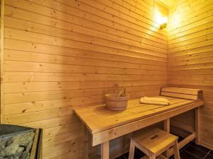 a wooden sauna with a wooden table and a bucket at Chalet Vrådal by Interhome in Vradal