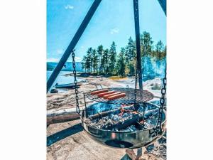 a grill with a bunch of hot dogs in it at Chalet Vrådal by Interhome in Vradal