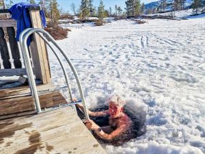 a man is swimming in the snow at Chalet Vrådal by Interhome in Vradal