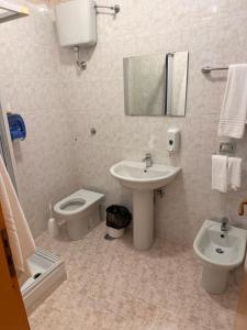 a bathroom with a sink and a toilet at B&B Da Felice in Serino