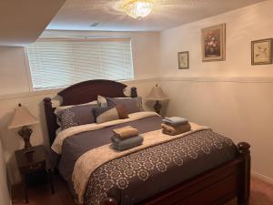 a bedroom with a large bed with pillows on it at Wasaga Dunes in Wasaga Beach