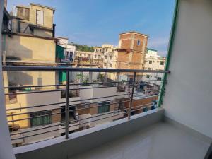 a balcony with a view of a city at Cox West Inn in Cox's Bazar +25 photos