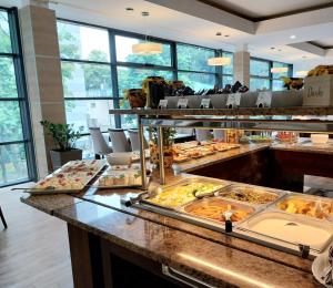 a buffet line with many different types of food at Phoenix in Kołobrzeg