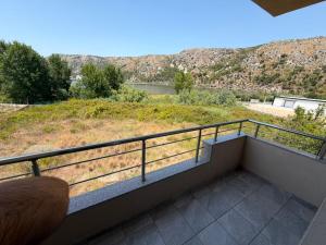 a balcony with a view of a mountain at Hotel Klaivi in Lezhë