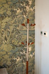 a wall mural with a pattern of trees at Penthouse at the Chocolate Box in Bournemouth +65 photos