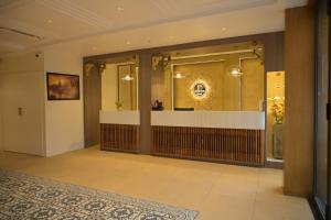 a lobby with a reception desk in a building at Hotel Bliss Kashi in Kakarmatha