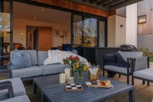 a living room with a couch and a table at Silvermere in Warmwell