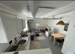 a large room with a kitchen and a living room at Galleriet BnB in Stenkyrka