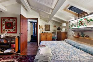 a bedroom with a large bed in a room at Villa Daphne Pool And Jacuzzi in Vescina +35 photos
