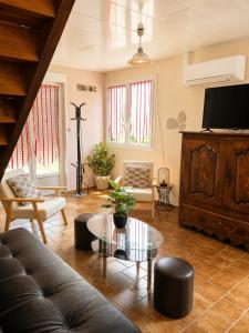 a living room with a couch and a table at Gîte Prat in Arette