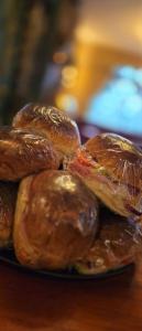 a pile of glazed donuts on a plate on a table at lyndon house hotel in Walsall