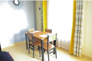 a dining room table and chairs in a room at 3 Bedrooms in Eldoret in Eldoret