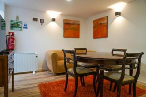 a room with a table and chairs and a bed at Casas Martinho - Algares in Piódão