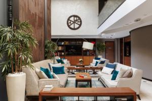 a living room with couches and blue pillows at Hotel Constantine the Great in Belgrade