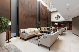 a lobby with couches and tables in a building at Hotel Constantine the Great in Belgrade