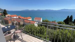 a balcony with a view of the ocean at Apartmani Alexa 2 in Brist