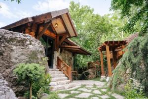 a house with a staircase leading up to it at Getahovit Resort in Ijevan