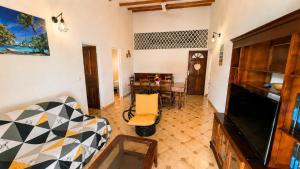 a living room with a couch and a table at La Casa Créole, spa, 3 ch, 2 sdb, centre de la Guadeloupe in Les Abymes