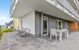 a patio with a table and chairs on a balcony at Ferienfreude in Winterberg