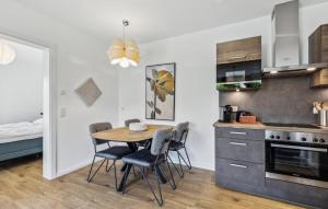 a kitchen and dining room with a table and chairs at Ferienfreude in Winterberg