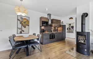 a kitchen and dining room with a table and a stove at Ferienfreude in Winterberg