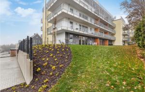 a building with a grassy yard in front of a building at Ferienfreude in Winterberg +6 photos