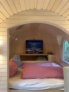 a room with two beds in a small room at Igluhuts Passail in Passail