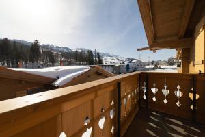 a balcony with a view of a snow covered mountain at Chalet Brisi - Luxury & Bergblick in Wildhaus