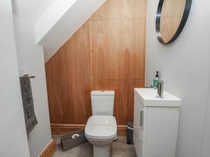 a bathroom with a toilet and a sink at Barn 2 in Sandbach +14 photos