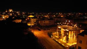 a view of a city at night with lights at Üçhisar Palace İn Cappadocia in Uçhisar
