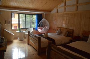 Cama o camas de una habitación en Yangjiajie Inn