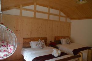 Cama o camas de una habitación en Yangjiajie Inn