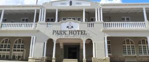 a white building with a park hotel sign on it at Park Hotel Bethlehem in Bethlehem